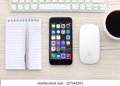 Alushta, Russia - October 25, 2014: New Phone IPhone 6 Space Gray With Apps On Screen Lies On The Table. IPhone 6 Was Created And Developed By The Apple Inc.