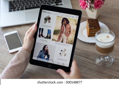 Alushta, Russia - October 9, 2016: Woman Holding A IPad Pro With Internet Shopping Service Amazon On The Screen. IPad Pro 9.7 Space Gray Was Created And Developed By The Apple Inc.