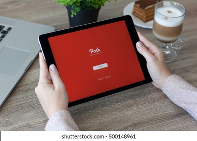 Alushta, Russia - October 9, 2016: Woman Holding A IPad Pro Space Gray With Image Hosting And Social Networking Service Path On The Screen. IPad Pro 9.7 Was Created And Developed By The Apple Inc.