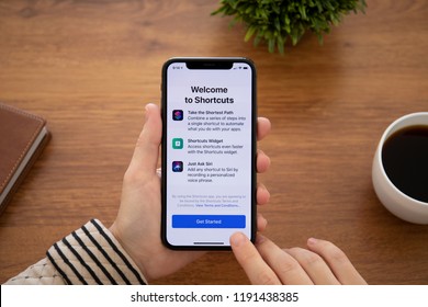 Alushta, Russia - September 26, 2018: Woman Hand Holding IPhone X With Home Screen Shortcuts App. IPhone 10 Was Created And Developed By The Apple Inc.