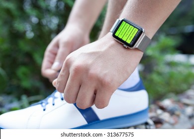 Alushta, Russia - September 3, 2015: Athlete Hand With Apple Watch And App Workout On The Screen. Apple Watch Was Created And Developed By The Apple Inc.