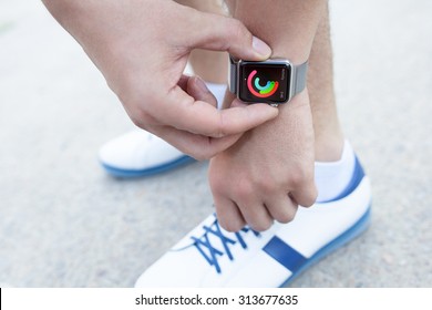 Alushta, Russia - September 3, 2015: Athlete Hand With Apple Watch And App Activity On The Screen. Apple Watch Was Created And Developed By The Apple Inc.