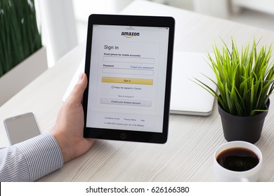 Alushta, Russia - September 3, 2016: Man Holding A IPad Pro With Online Shopping Service Amazon On The Screen. IPad Pro 9.7 Space Gray Was Created And Developed By The Apple Inc.