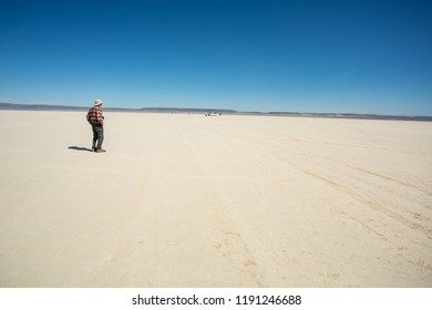 Alvord desert, Oregon - 9/20/2018:  A man standing on the Alvord desert, located just east of the Steens mountains near Frenchglen in south central Oregon.