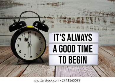It's Always a Good Time to Begin text with alarm clock on wooden background