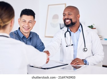 Its Always Great Meeting New Clients. Shot Of Two Doctors Shaking Hands At A Clinic.