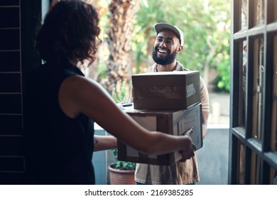 Always Providing My Clients With World Class Service. Shot Of A Handsome Young Man Delivering Parcels To A Hairdresser At Her Salon.