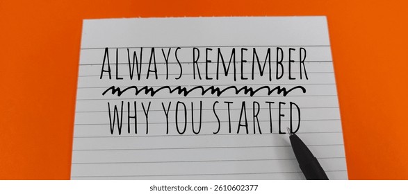 Always Remember Why You Started  – Motivational Message Written on Paper with Black Pen on Orange Background, Concept of Purpose, Persistence, and Business Success. 