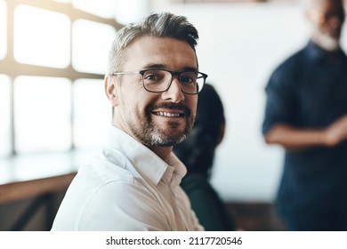 I'm Always Setting New Goals. Cropped Portrait Of A Businessman Sitting In The Boardroom During A Presentation.