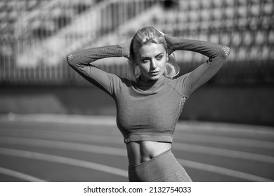 Always In Shape. Sexy Fitness Woman In Sportswear. Athletic Lady With Sexy Abs At Stadium. Female Athlete Ready For Sport Workout. Trainer Or Coach Training. Perfect Body Shape. Healthy And Sporty