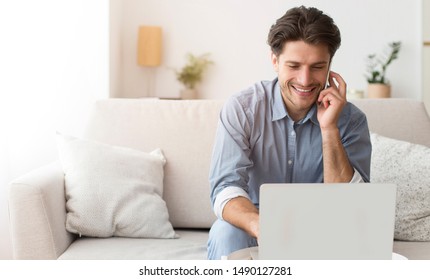 Always In Touch. Businessman Talking On Phone Working On Laptop At Home. Free Space