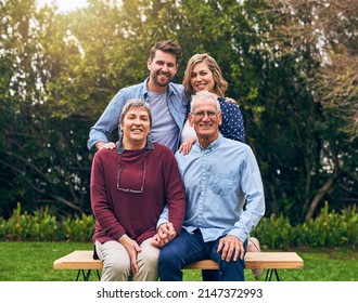 Always Try To Spend As Much Time With Your Parents. Shot Of A Family Outside.