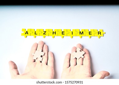 Alzheimer's Disease, Concept, The Word Alzheimer Is Made Up Of Puzzles In Yellow With Black Letters