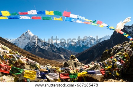 Ama Dablam framed with praying flags - Nepal