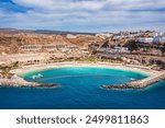 Amadores beach (Spanish: Playa del Amadores) near famous holiday resort Puerto Rico de Gran Canaria on Gran Canaria island, Spain. Playa de Amadores beach near Puerto Rico town, Canary Islands. Spain