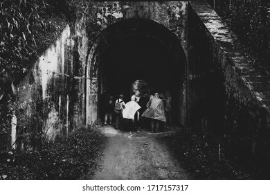 Amaga, Antioquia / Colombia. March 31, 2019. People Emerging From A Dark Tunnel Into The Light