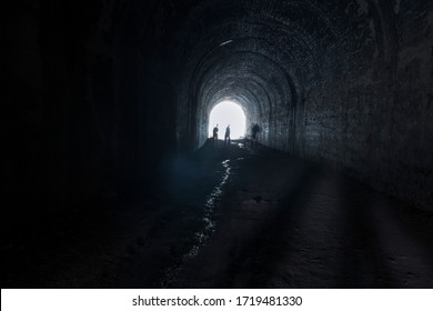Amaga, Antioquia / Colombia. March 31, 2019. People emerging from a dark tunnel into the light
