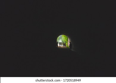 Amaga, Antioquia / Colombia. March 31, 2019. People Emerging From A Dark Tunnel Into The Light