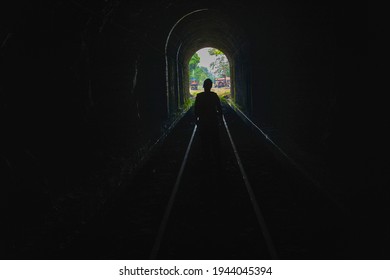 Amaga, Antioquia, Colombia. March 31, 2019. People Emerging From A Dark Tunnel Into The Light