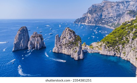 The Amalfi Coast is a breathtaking stretch of coastline in southern Italy, known for its vertiginous cliffs adorned with colorful villages, turquoise waters, and lush terraced gardens. - Shutterstock ID 2354381251