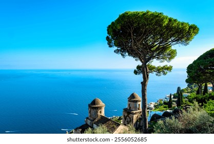 The Amalfi Coast dazzles with its turquoise sea and towering trees casting shadows over ancient stone structures on a sunny afternoon. Ravello Italy at sunset - Powered by Shutterstock