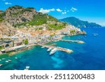 Amalfi on Amalfi Coast, Italy. Aerial photo of famous city Amalfi located on Amalfi Coast with blue sea water and beautiful colorful houses on the cliff