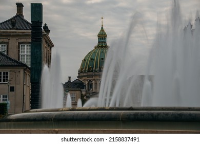 The Amalienborg - The Home Of The Danish Royal Family Behind Fountains In Copenhagen