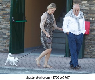 
Coruña-Spain. Amancio Ortega, Founder Of The Fashion Group Inditex, With His Wife Flora Pérez Walking The Dog On July 27, 2012