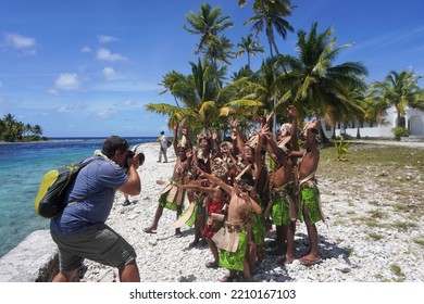 Amanu Atoll, Tuamotu Archipelago, French Polynesia, September 13, 2022. Group Of Traditionally Dressed Polynesian Children Cheering For A Photographer