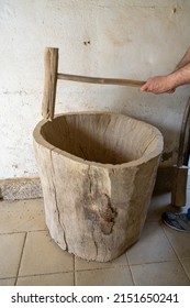 AMARANTE, PORTUGAL - APRIL 30: Potter Performs The Manual Grinding Of Clay Using A Wooden Spike On April 30, 2022 In Amarante, Portugal.