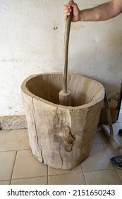 AMARANTE, PORTUGAL - APRIL 30: Potter Performs The Manual Grinding Of Clay Using A Wooden Spike On April 30, 2022 In Amarante, Portugal.