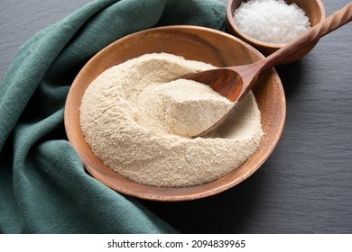 Amaranth Flour With A Spoon In Wooden Bowl On Black Slate Background High Angle View