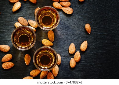 Amaretto Almond Liqueur With A Dark Background, Top View