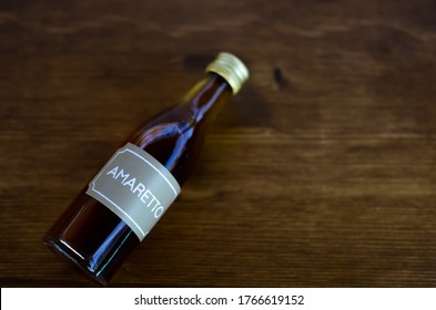 Amaretto Bottle On The Wooden Table