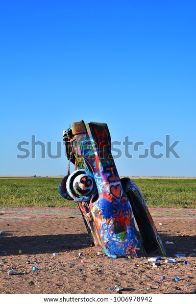 Amarillo, Texas - July 21,\
2017 : Cadillac Ranch in Amarillo. Cadillac Ranch is a public art\
installation of old car wrecks and a popular landmark on historic\
Route 66
