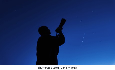 Amateur astronomer and astrophotographer photographing the evening skies, observing planets, stars, Moon and other celestial objects with a camera. - Powered by Shutterstock