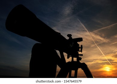 Amateur Astronomy Observer With A Telescope Ready For The Eclipse. Science And Hobby With Empty Copy Space For Editor's Text.