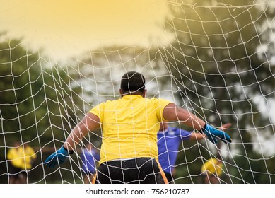 An Amateur Goalkeeper Prepares To Make A Save From An Oncoming  Shot At Goal, During A Soccer Game.
