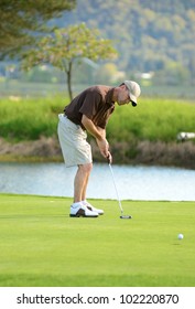 A Amateur Golfer Competes On A 18 Hole Golf Course