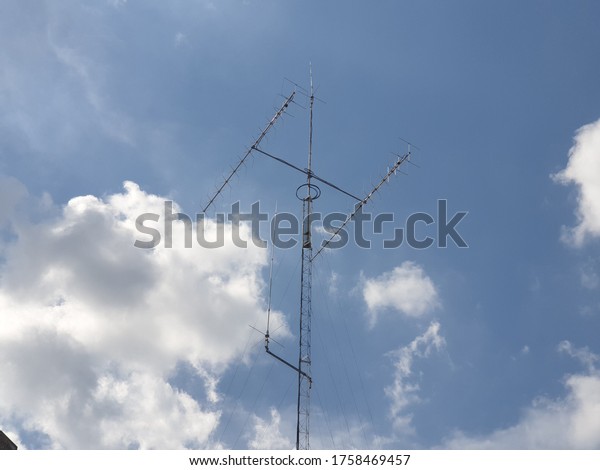 Amateur radio\
antenna with blue sky\
background