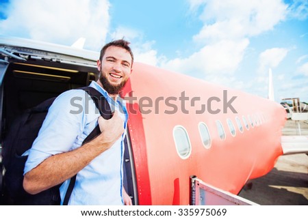 amateur style photo of backpacker boarding the airplane