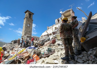 Amatrice, Italy - August 24, 2016: Rescue Workers Search For Survivors In The Rubble After The Earthquake That Hit The City Of Amatrice, In Central Italy.

