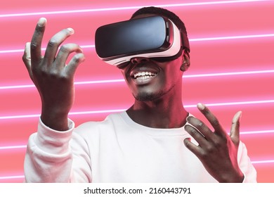 Amazed African American Man Looking At His Ar Hands Through Vr Glasses, Playing Video Games With Virtual Reality Headset In Rmetaverse Over Striped Luminous Background