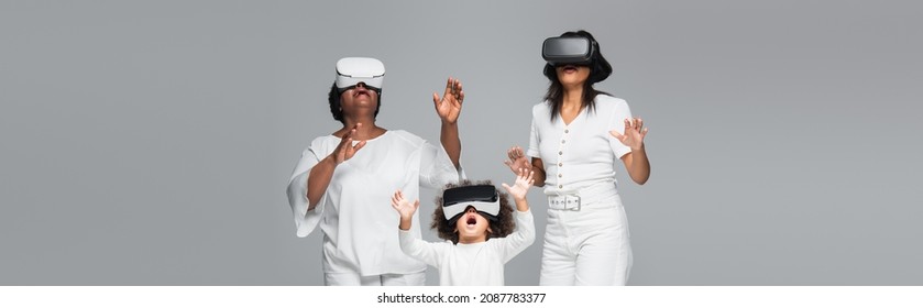 amazed african american women and child gaming in vr headsets isolated on grey, banner - Powered by Shutterstock