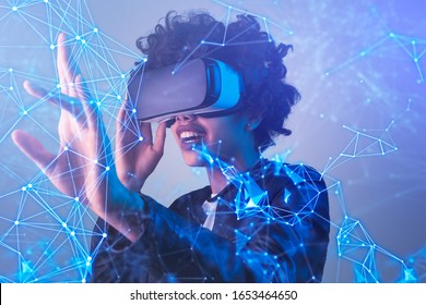 Amazed black female in modern VR glasses interacting with network while having virtual reality experience