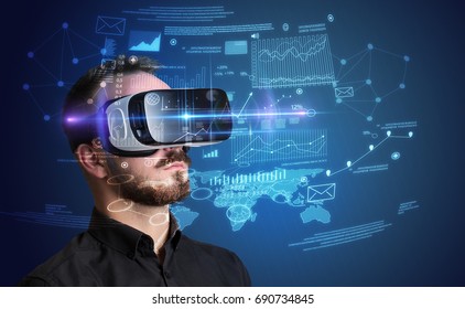 Amazed Businessman With Virtual Reality Business Plan In Front Of Him 