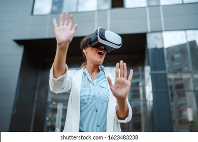 Amazed Charming Stylish Young Woman Having Vr Experience Outdoor For The First Time In Her Life. Millennial Generation.