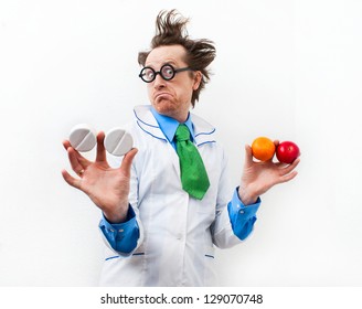 Amazed doctor with tablet and fruit in hand