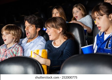 Amazed Families Watching Movie In Cinema Theater