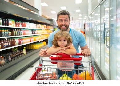 Amazed family father and child son with shopping cart buying food at grocery store or supermarket. Surprised face. Man shopper with groceries. - Powered by Shutterstock